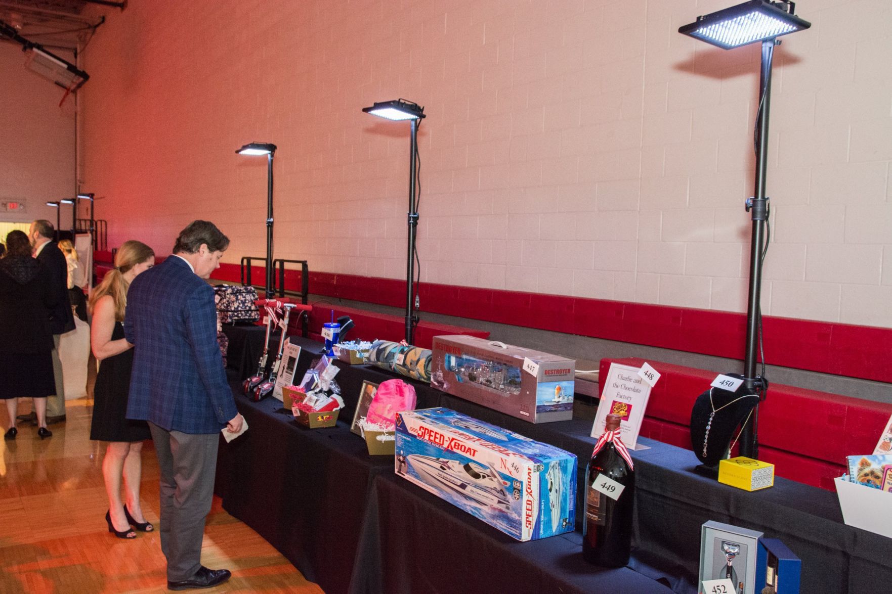 Guests look at the items available for auction